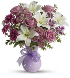 Teleflora's Precious in Purple. An arrangement by Devine Orchid.