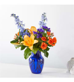 Radiant Citrus. An arrangement by Country Cousins Flower Shop.