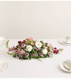 Romantic Blush™ Centerpiece. An arrangement by Sicola's Florist.