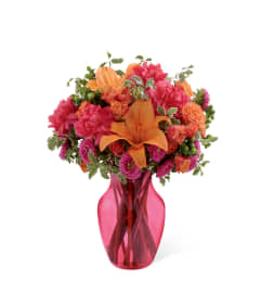 The FTD® All Is Bright™ Bouquet. An arrangement by Sunrise Floral and Gifts.