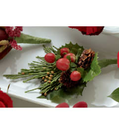 The FTD® Red Berry Boutonniere. An arrangement by Mystic Garden Floral.