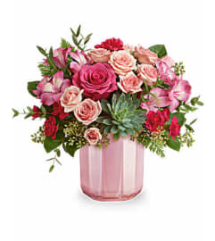Teleflora's Rosy Radiance Bouquet. An arrangement by Marivel's Florist and Gifts.
