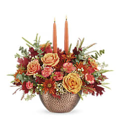 Teleflora's Gleaming Copper Centerpiece. An arrangement by Marivel's Florist and Gifts.