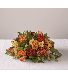 Bountiful Centerpiece. An arrangement by Shalimar Flower Shop.