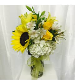 SUMMER TIME. An arrangement by The Floral Basket.