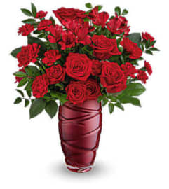 Teleflora's Love Blossoms Flower Bouquet. An arrangement by Marivel's Florist and Gifts.