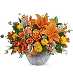 Teleflora's Golden Bounty Centerpiece. An arrangement by Margaret's Florist.