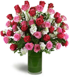Opulent Roses™. An arrangement by Riverfront Flowers N' More.