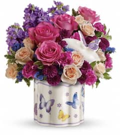 Teleflora's Dancing In Joy Bouquet. An arrangement by Devine Orchid.
