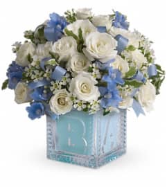 Baby's First Block by Teleflora - Blue. An arrangement by Pompano Beach Floral.