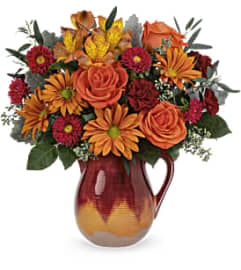 Teleflora’s Autumn Glaze Bouquet. An arrangement by Marivel's Florist and Gifts.