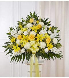 Heartfelt Sympathies™ Yellow Standing Basket. An arrangement by Graceland Florist.