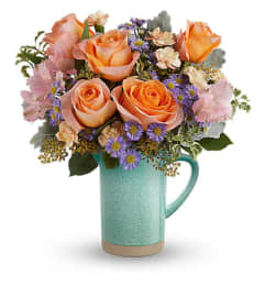 The Teleflora's Aqua Amour Bouquet. An arrangement by Marivel's Florist and Gifts.