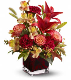 Teleflora's Indian Summer. An arrangement by Marivel's Florist and Gifts.