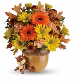 Teleflora's Send a Hug™ Fetching Fall Bouquet. An arrangement by Pompano Beach Floral.