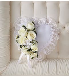 White Satin Heart Casket Pillow. An arrangement by Blessing and Blooms Florist.