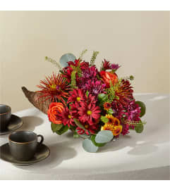 Autumn Herald Cornucopia. An arrangement by Fink Flowers, Gifts and Flower Delivery.