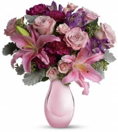 Enchanting Pinks by Teleflora. An arrangement by Devine Orchid.