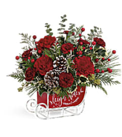Teleflora's Vintage Sleigh Ride Bouquet. An arrangement by Margaret's Florist.