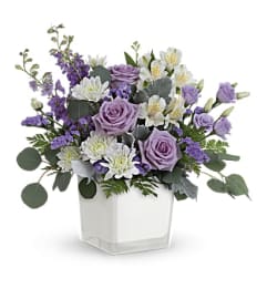 Teleflora's Honey Lavender Blooms Bouquet. An arrangement by Flowers and Pine World.