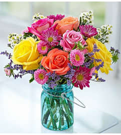 Garden Bouquet™ in a Mason Jar. An arrangement by Blessing and Blooms Florist.