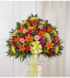 Heartfelt Sympathies™ Bright Standing Basket. An arrangement by Graceland Florist.