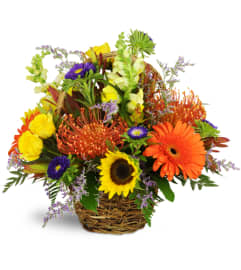 Autumn Joy Basket™. An arrangement by Erika's Flowers.