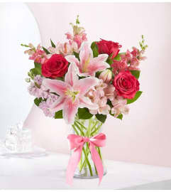 Mother’s Embrace™ in a Clear Vase. An arrangement by Graceland Florist.