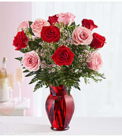 Shades of Pink and Red™. An arrangement by Sicola's Florist.