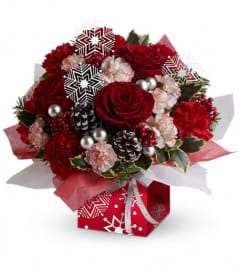 Teleflora's Snow Flurries Present Perfect. An arrangement by Artistic Way Flowers.