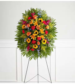 Vibrant Funeral Standing Spray. An arrangement by Sicola's Florist.