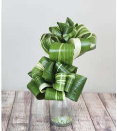 Bottled Up. An arrangement by The Flower Boutique.