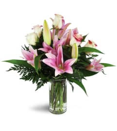 Alluring Roses and Lilies™. An arrangement by Abundant Flowers and Gift Shoppe.