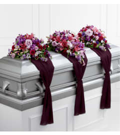 The FTD® Refreshing Mix™ Casket Spray. An arrangement by Mystic Garden Floral.