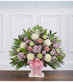 Heartfelt Tribute™ Floor Basket- Pastel. An arrangement by Lovingly.