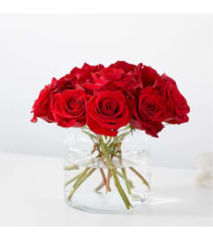 The Cupid's Embrace Red Rose Bouquet. An arrangement by Country Cousins Flower Shop.