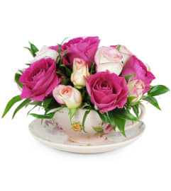Teacup of Roses. An arrangement by Westchester Flowers and Gifts.