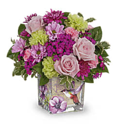 Teleflora's Hummingbird Garden Bouquet. An arrangement by Marivel's Florist and Gifts.