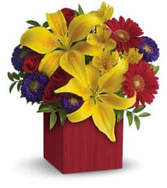 Teleflora's Summer Brights. An arrangement by Pompano Beach Floral.