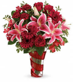 Teleflora's Swirling Desire Bouquet. An arrangement by Devine Orchid.