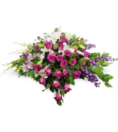 Forever Adored Casket Spray. An arrangement by Abundant Flowers and Gift Shoppe.