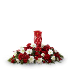 The FTD® Celebrate the Season™ Centerpiece 2015. An arrangement by Flamingo Floral and Gifts.