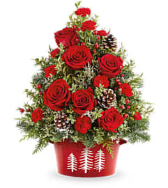 A Teleflora's Holiday Traditions Tree. An arrangement by Marivel's Florist and Gifts.