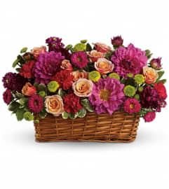 Burst of Beauty Basket. An arrangement by The Village Green Florist.