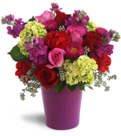 Bursting with Blooms™. An arrangement by Erika's Flowers.