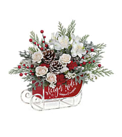 Teleflora's Frosted Sleigh Bouquet. An arrangement by Margaret's Florist.