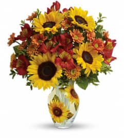 Teleflora's Simply Sunny Bouquet. An arrangement by Pompano Beach Floral.