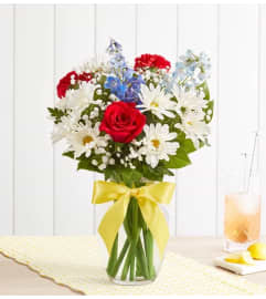 Tie a Yellow Ribbon™. An arrangement by Blessing and Blooms Florist.