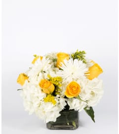 Sunlight Through Clouds. An arrangement by Masters and Company Florist.