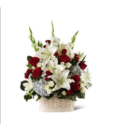 The FTD® Greater Glory™ Basket. An arrangement by Petals.